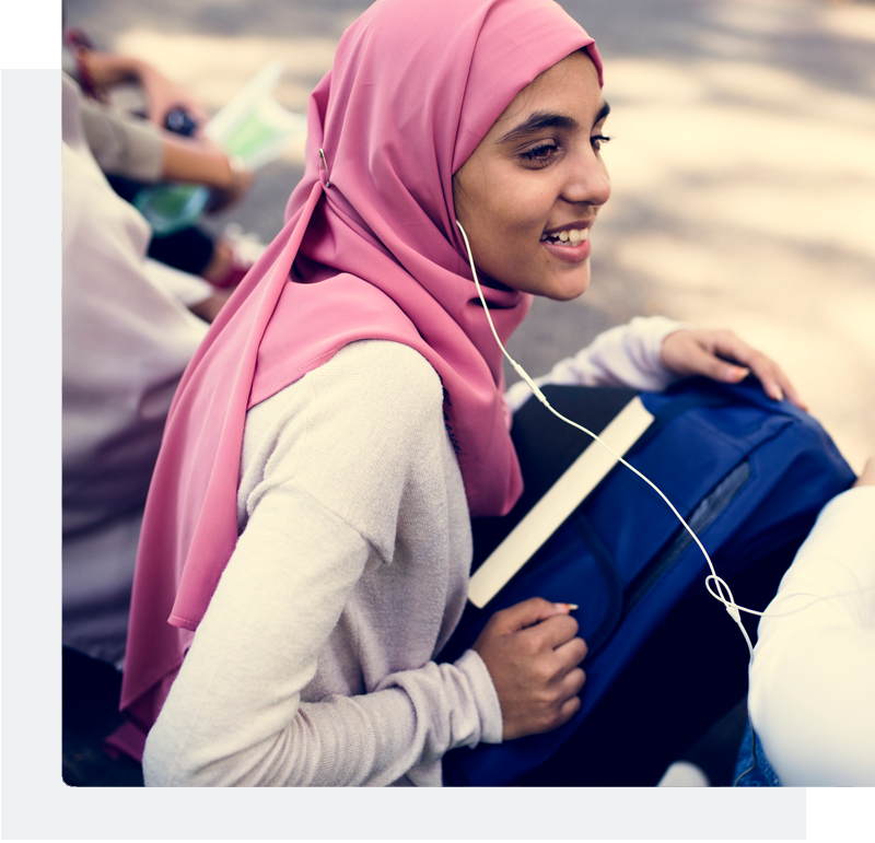 girl in hijab listening to music