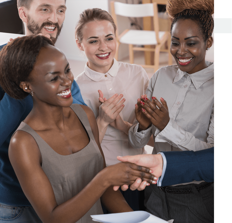 group of people congratulating a women